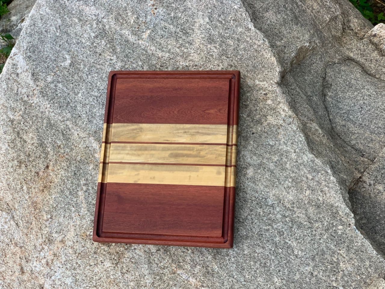 Striped cutting board with juice groove