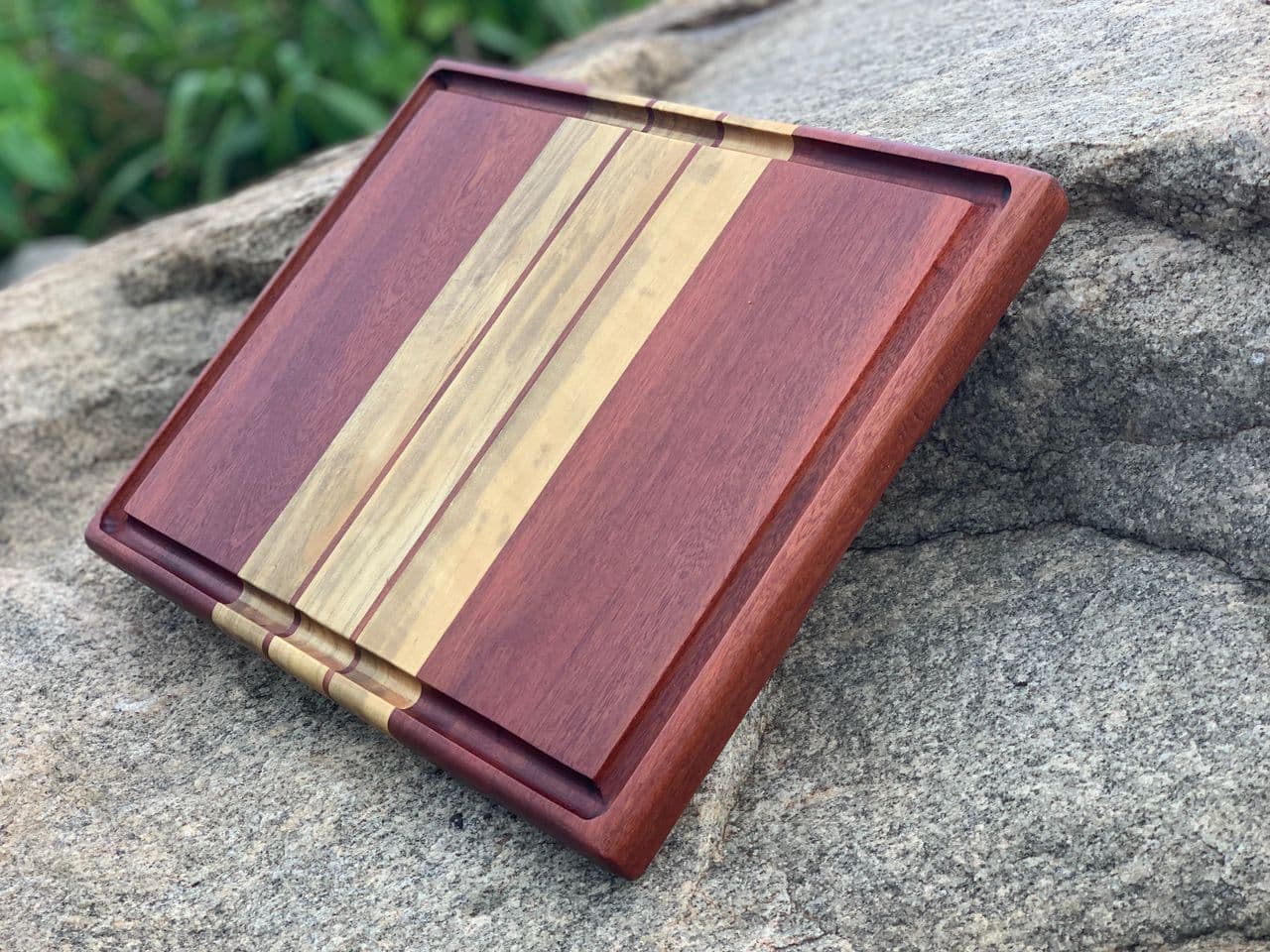 Hardwood board resting on granite